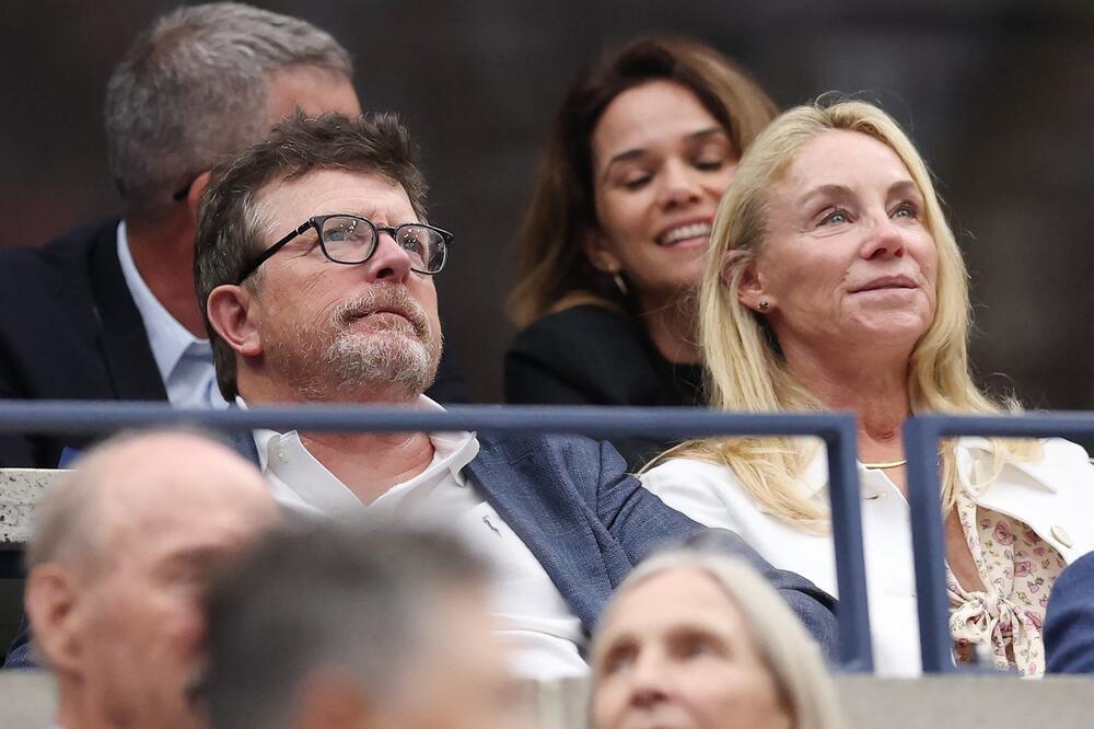 Glumac Majkl Dž. Foks sa suprugom Trejsi na finalu US Opena